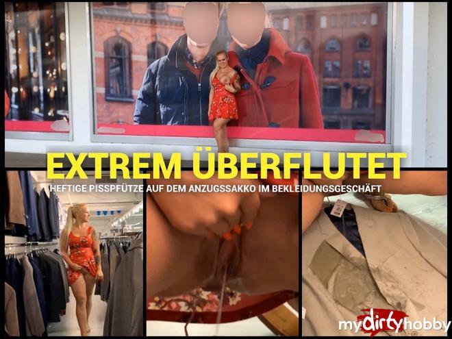 EXTREMELY OVERFLOWED - Violent piss puddle on the suit jacket in the clothing store